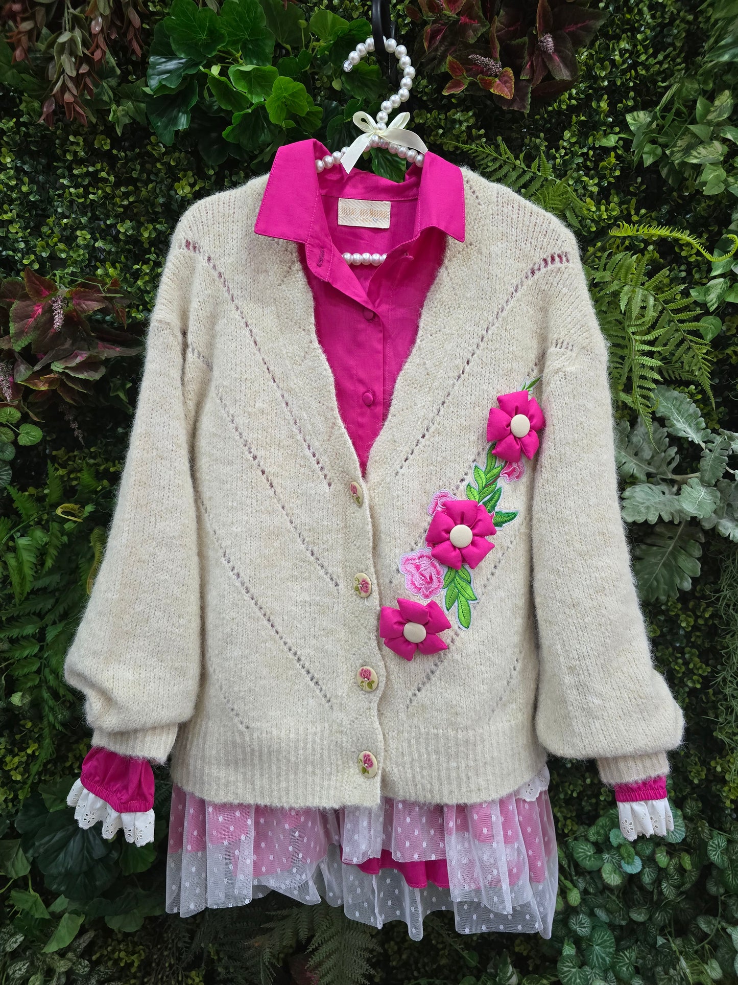 Casaco flor e pregadeiras